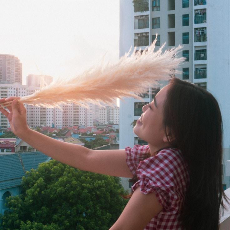 Alex Kim, Lead Design Curator at Crystal Horizon Platform, reviewing corporate floral arrangements